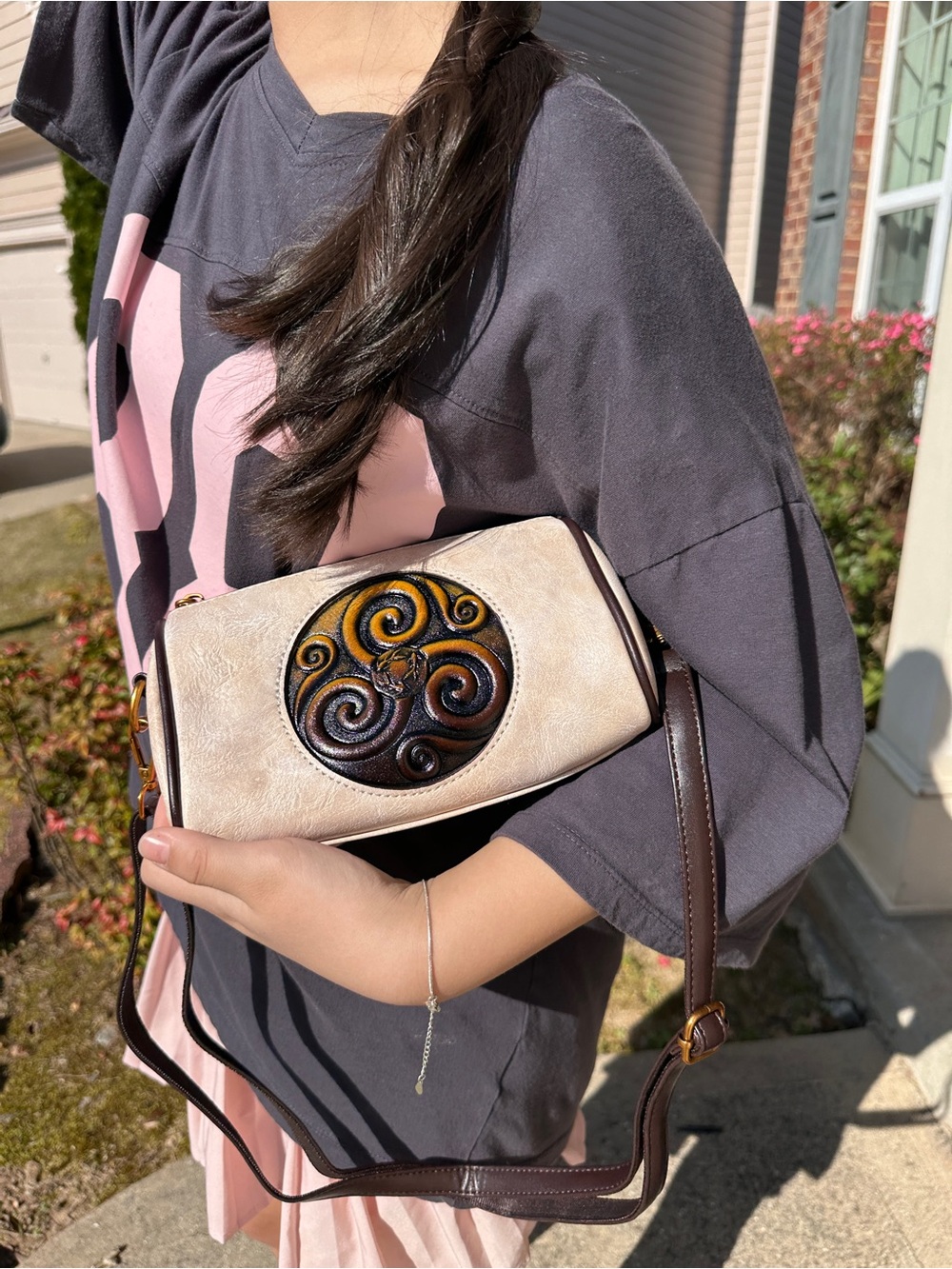 Handcrafted Cream Leather Crossbody Bag with Decorative Medallion